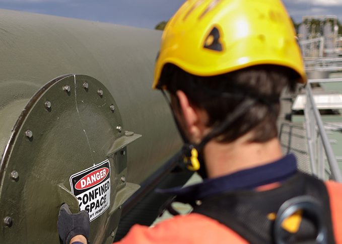 A worker entering into a Confined Space