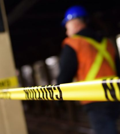 Man in construction site with incident management software