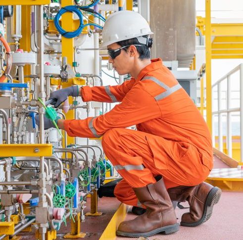 A Worker checking Water Pipes An employee checking readings
