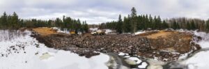 Aerial view of a natural dam in the woods of the Canadian shield.d