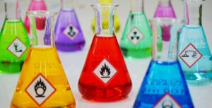 chemical hazards all displayed with various colours of liquids and symbols