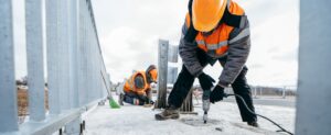 specialist work and drill in the cold on a roof with scaffolding